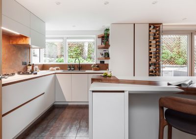 copper wall panels used as splashbacks and decorative wine rack