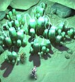 The bioluminescent sponge-like growths. Note the strong light and scale alongside Sarah Palmer.