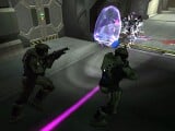 Two Spartans fighting a SpecOps Sangheili during cooperative play.