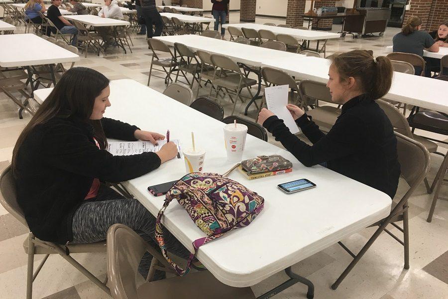 Seniors Sierra Eichman and Jeanie Balzer participate in Kids Vote Kansas. 