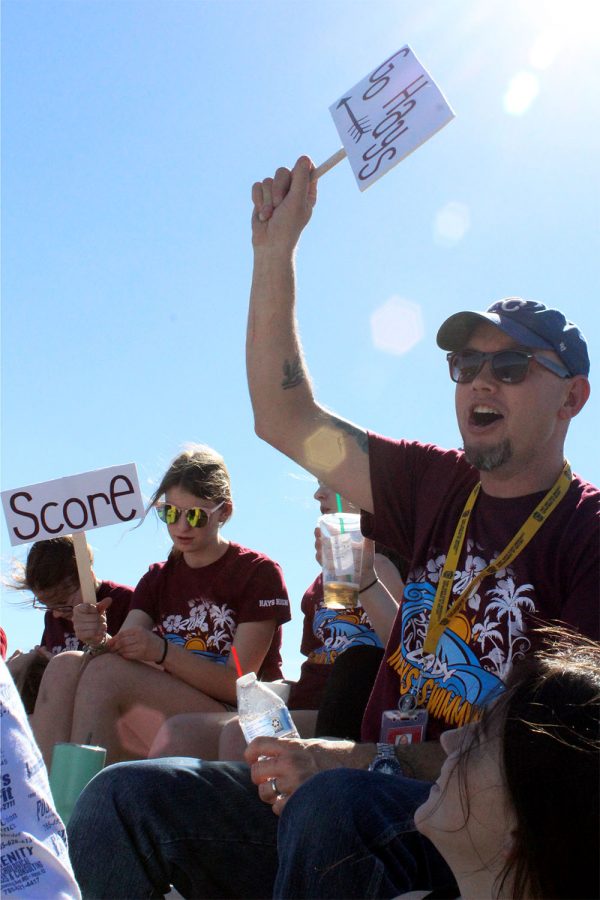 Cheering on the lady Indians soccer team is swimming coach Luke Lundmark. On April 8 Lundmark canceled swim practice so that the swim team could support another Hays High team. “This was a great way for my team to bond while also supporting another team,” Lundmark said. 