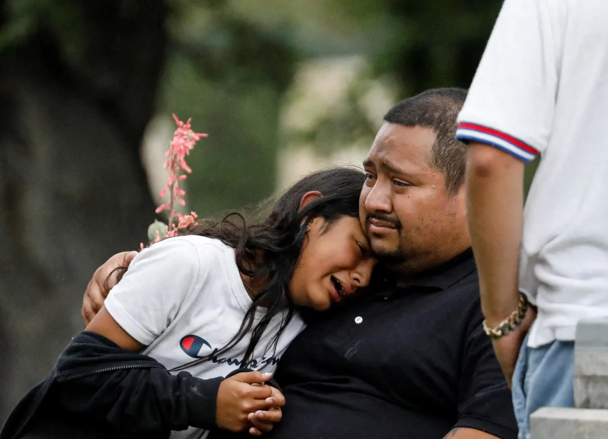 
People wait to hear news after the mass shooting at Robb Elementary School, in Uvalde, Texas. 