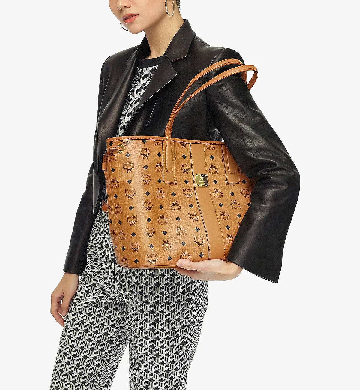 Fashion Forward - Model Showcasing Mcm Shoulder Bag Wallpaper