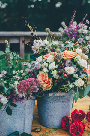 Assorted Flowers On Gray Metal Bucket Wallpaper