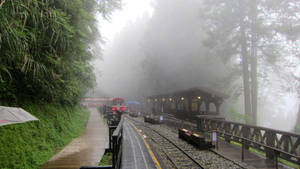 Beautiful Rain At The Train Station Wallpaper