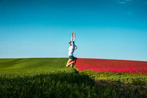 Flower Field Jumping Wallpaper