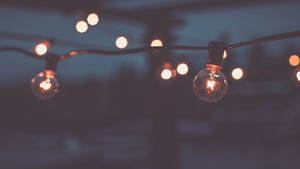 Indie Aesthetic Laptop Light Bulbs At Night Wallpaper