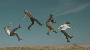 Indie Aesthetic Laptop People In Mid-air Wallpaper