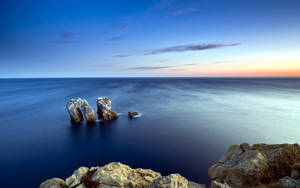 Natural Rock Formations At Sea Wallpaper