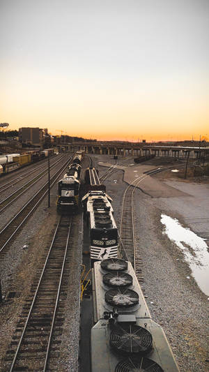 Overhead View Of Railroad Tracks And Trains Wallpaper