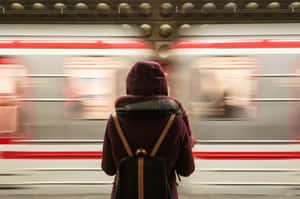 Person Waiting For A Train Wallpaper