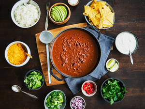 Savory Chili Con Carne With Delightful Side Dishes Wallpaper