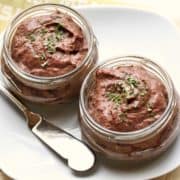 Chicken liver pate is served in glass containers.