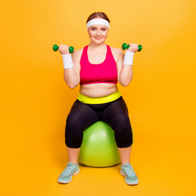 woman lifting weights on a stability ball