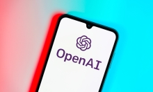 Smartphone on surface showing OpenAI logo. OpenAI is a nonprofit organization for artificial intelligence research.