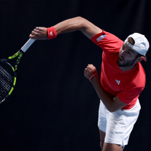 Britain's Jacob Fearnley serves against France's Arthur Cazaux