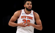 Karl-Anthony Towns #32 of the New York Knicks grabs his thumb after a shot in the second half against the Brooklyn Nets at Barclays Center on January 21, 2025 in the Brooklyn borough of New York City. The New York Knicks defeated the Brooklyn Nets 99-95. 