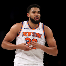 Karl-Anthony Towns #32 of the New York Knicks grabs his thumb after a shot in the second half against the Brooklyn Nets at Barclays Center on January 21, 2025 in the Brooklyn borough of New York City. The New York Knicks defeated the Brooklyn Nets 99-95. 