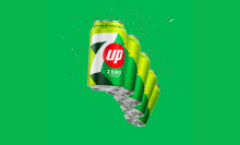 Five cans of 7UP in a, arc on a green background.