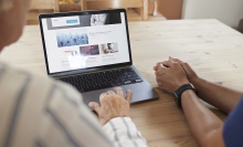 A doctor and patient consult a health website.