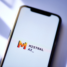 The Mistral AI logo on a smartphone