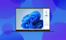 An Asus Zenbook laptop appears on an abstract bubble blue background with a plume of blue appearing on the screen.