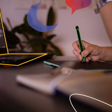 A person writing on a digital pad with a stylus. 