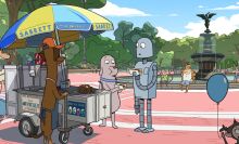 In a still from "Robot Dreams," a dog and a robot have a hot dog in Central Park, New York.