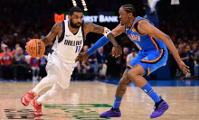 Kyrie Irving #11 of the Dallas Mavericks handles the ball in front of Jalen Williams #8 of the Oklahoma City Thunder during the second half at Paycom Center on January 23, 2025 in Oklahoma City, Oklahoma.