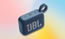 blue jbl go 4 portable speaker against a red, blue, and yellow gradient background