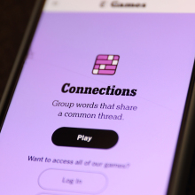 A close-up of an NYT Connections game on a smartphone.