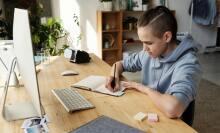 Boy studying in front of screen