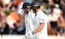 Joe Root of England and Ben Stokes of England walk off