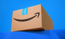 an amazon box against a bright blue background