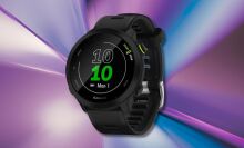 garmin forerunner 55 watch on a purple and blue background