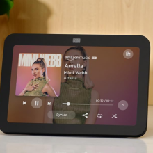 echo device in black sitting on a white counter 