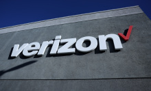 A sign is posted on the exterior of a Verizon store on September 30, 2024 in Daly City, California