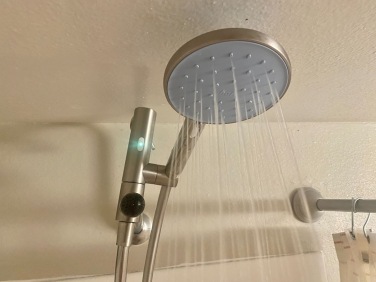 showerhead with green LED light lit up