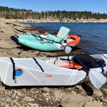 Two kayaks on a lake shore