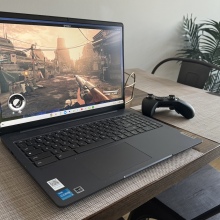 Lenovo Gaming Chromebook 16 sitting on a table with an Xbox controller