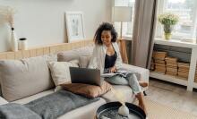 Woman looking at laptop