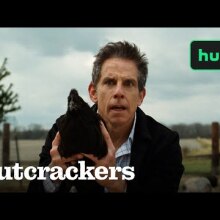 Ben Stiller holds a chicken.