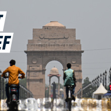 A still image showing a main road in New Delhi in the heat. Caption reads: "heat relief"