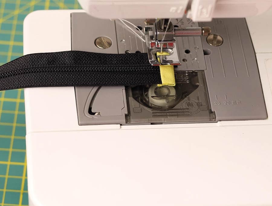 adding tabs to the zipper of the bum bag