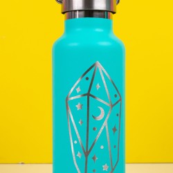 Aqua blue tumbler with a "magical" type of image etched out of the front