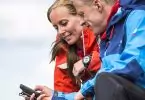 man and woman looking in gps