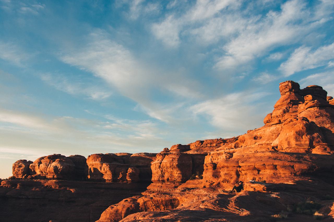 Climb up the huge rock formation (no gear required) behind the campsite for an incredible spot to watch the sun go down over the red desert. 