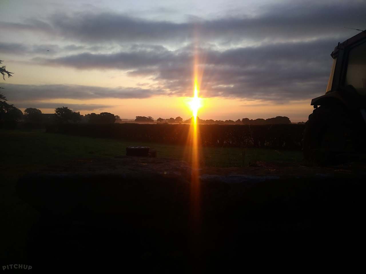 Sunset over camping field