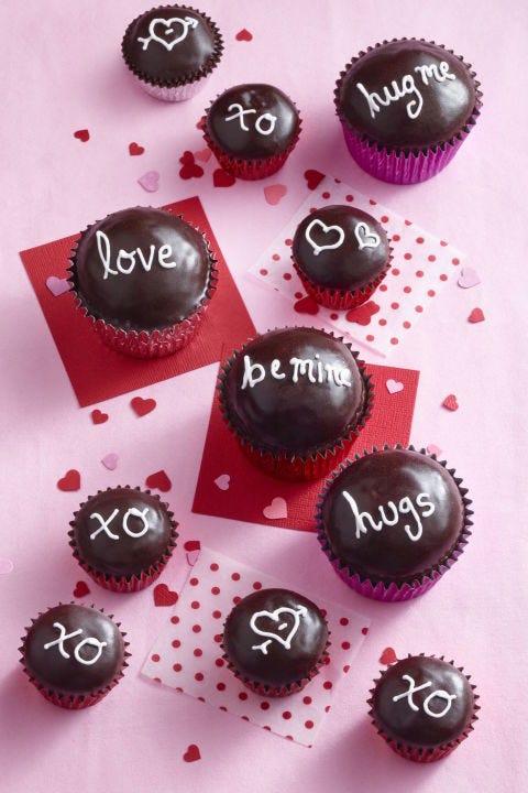 chocolate valentine's day cupcakes with love phrases on top