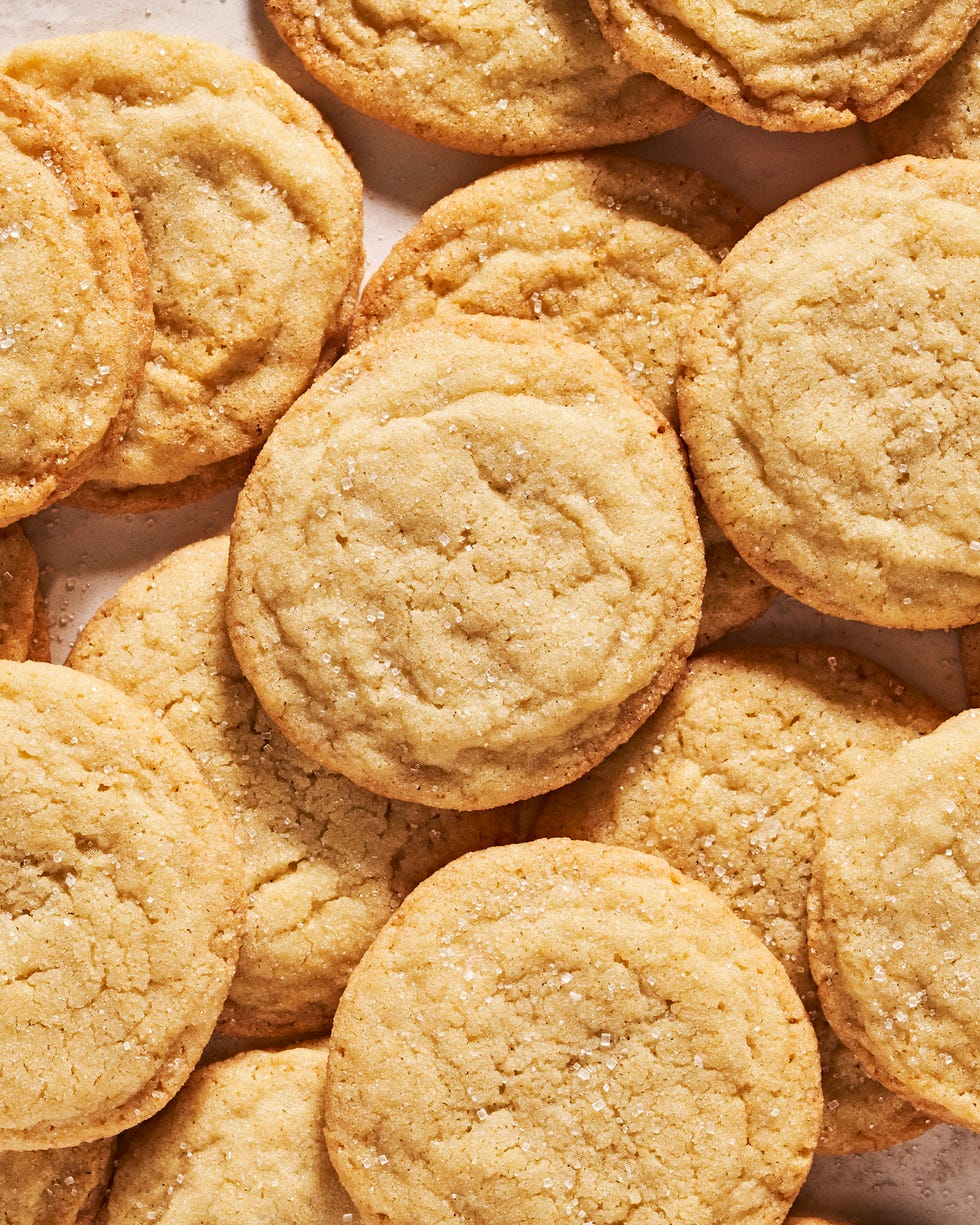 sugar cookies piled on a counter